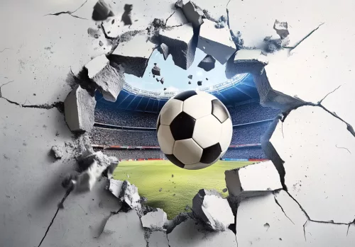 Stadionból falon keresztül kitörő focilabda poszter, fotótapéta