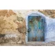 Vlies Fotótapéta - Stone wall and blue door - 375x250 cm