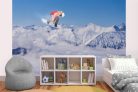 Vlies Fotótapéta - Flying snowboarder on mountains - 375x250 cm