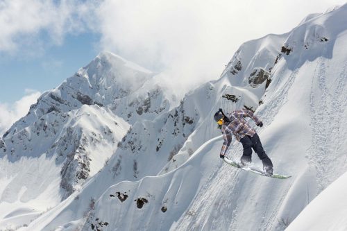 Vlies Fotótapéta - snowboarder on mountains - 375x250 cm