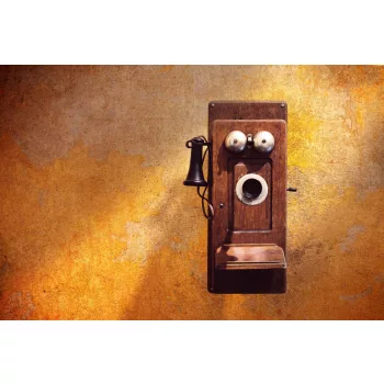  Vlies Fotótapéta - Antique Telephone on Yellow Wall - 375x250 cm