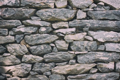 Vlies Fotótapéta - Grey stone wall - 375x250 cm