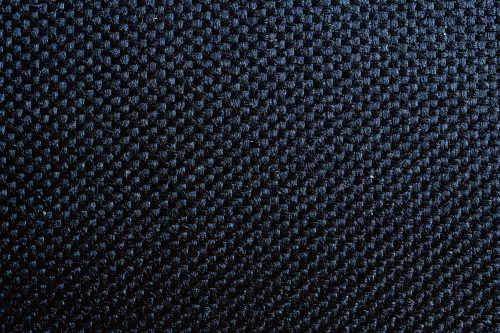 Vlies Fotótapéta - macro photo of black material - 375x250 cm