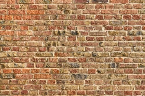 Vlies Fotótapéta - brick wall from many red bricks - 375x250 cm